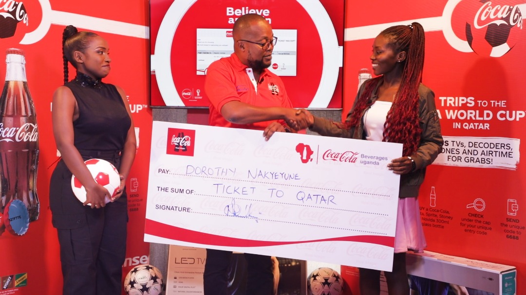 https://www.primenews.co.ug/wp-content/uploads/2022/10/Newton-Lee-Ogong-Chanels-Trade-Marketing-Manager-Coca-Cola-Beverages-Uganda-handing-over-the-dummy-ticket-to-the-first-Ticket-winner-Dorothy-Nakyeyune.jpeg